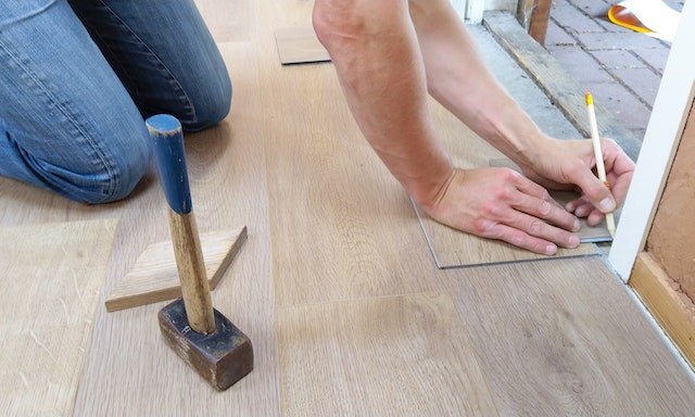 A person fixing a floor