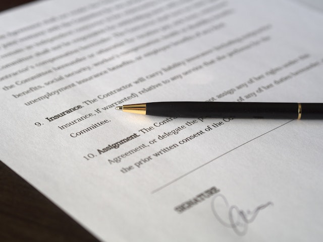 Pen on top of a lease agreement.